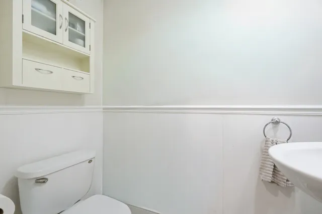 a bathroom with a toilet and a sink