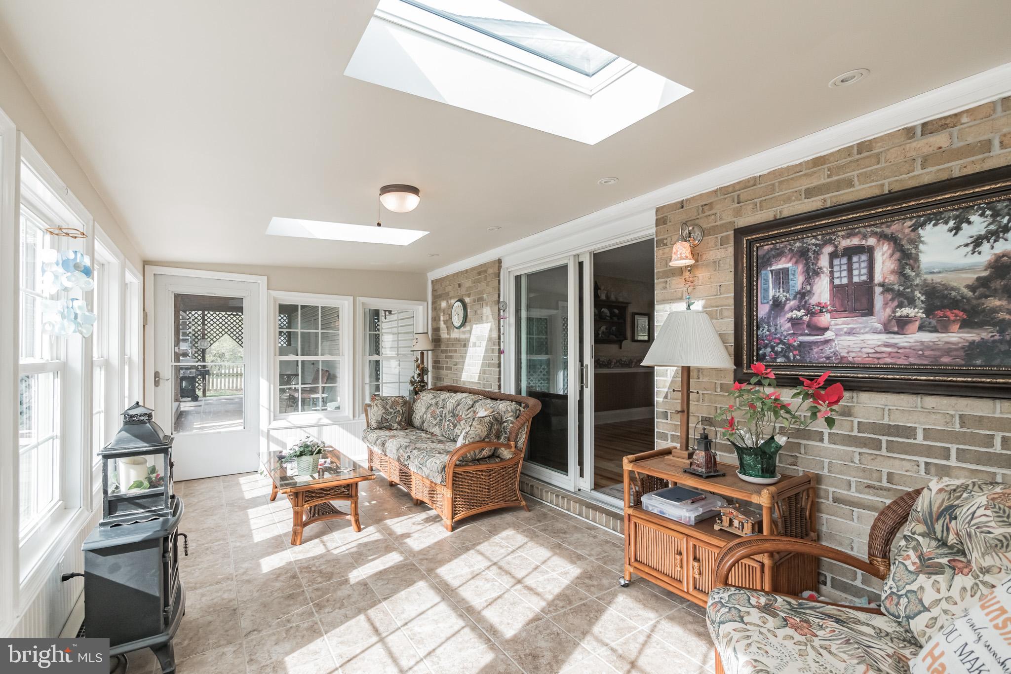 410 Lockhouse Road Falling Waters, WV 25419 - Photo 9 of 30 Main Level Sunroom with Tile Floor