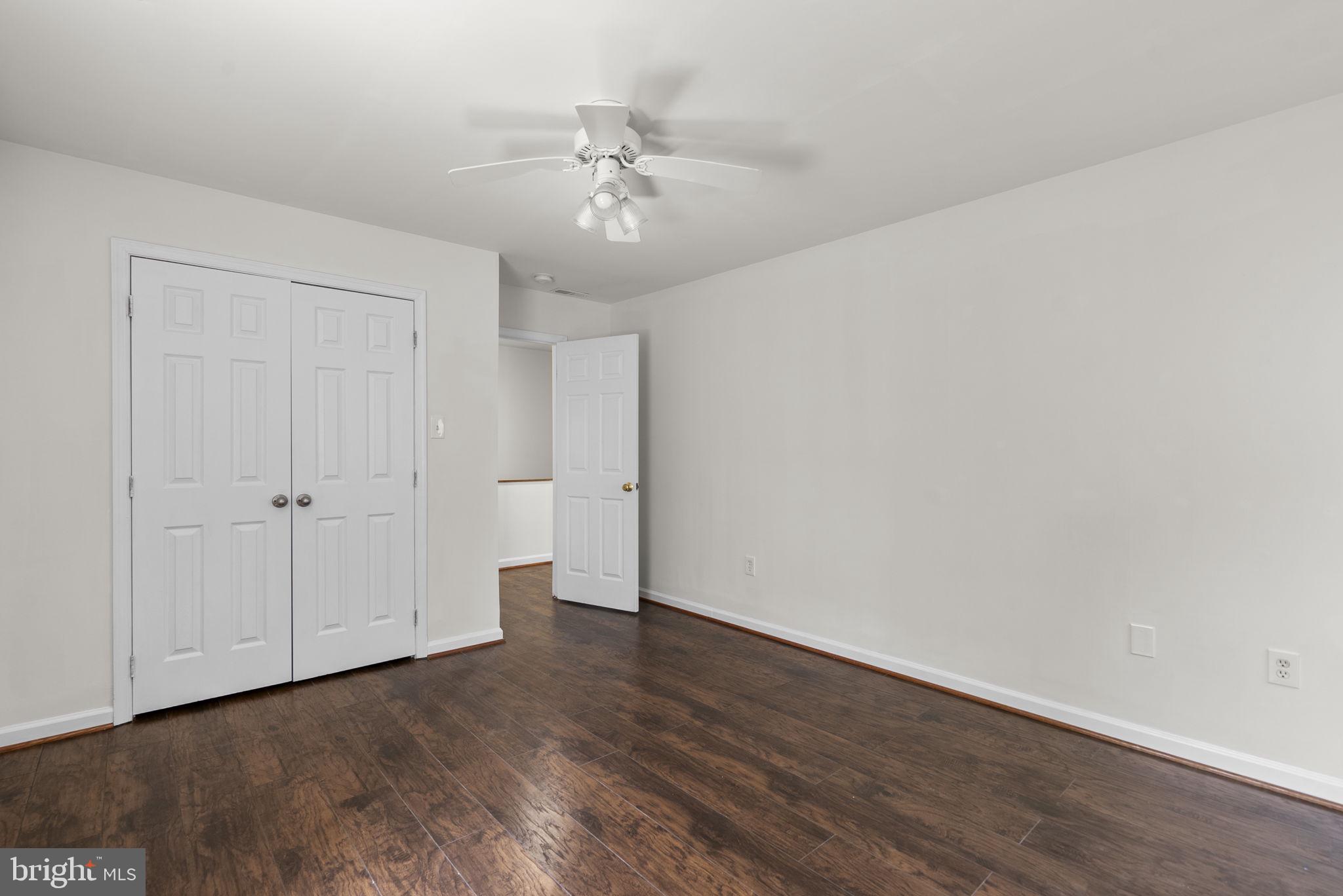 24000 Clarksburg Road Clarksburg, MD 20871 - Photo 39 of 60 a view of an empty room with wooden floor