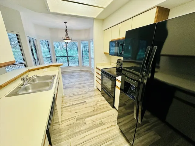a view of a living room with furniture and a flat screen tv