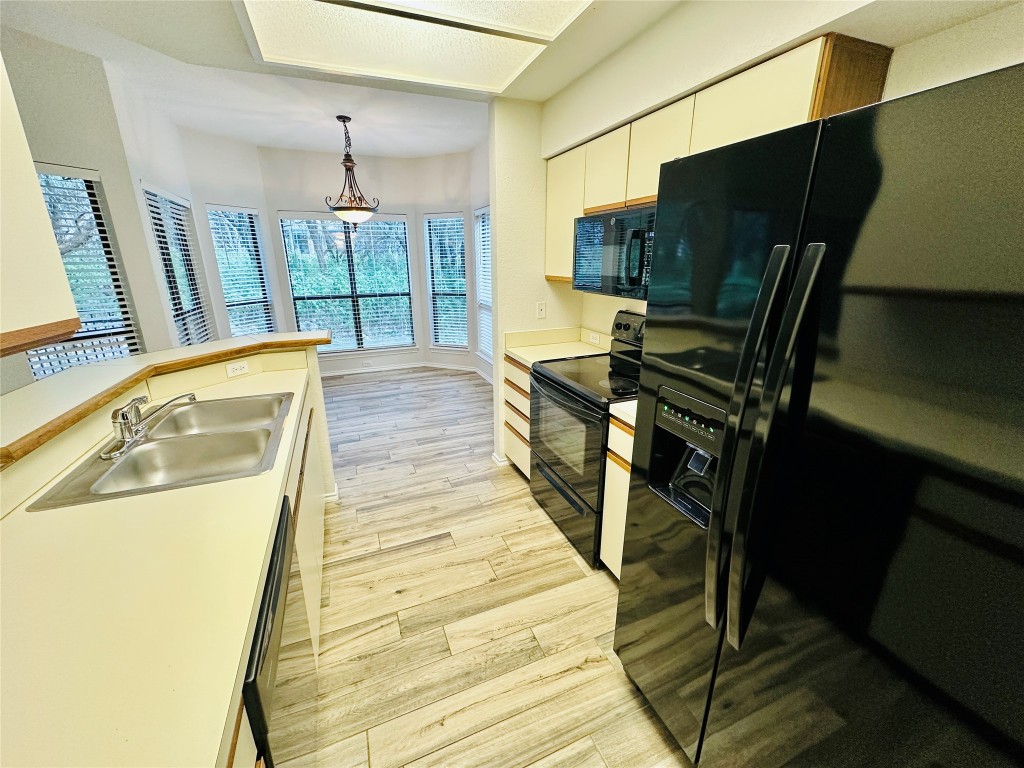 4711 Spicewood Springs Road, Unit 3118 Austin, TX 78759 - Photo 11 of 25 a view of a living room with furniture and a flat screen tv