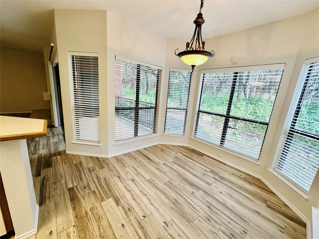 4711 Spicewood Springs Road, Unit 3118 Austin, TX 78759 - Photo 12 of 25 a view of a room with wooden floor and windows