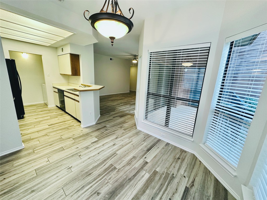 4711 Spicewood Springs Road, Unit 3118 Austin, TX 78759 - Photo 25 of 25 a view of a room with wooden floor and furniture