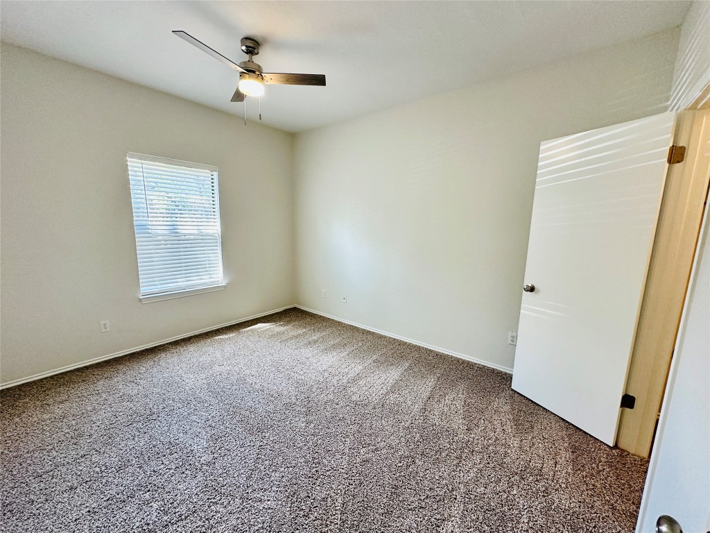 4711 Spicewood Springs Road, Unit 3118 Austin, TX 78759 - Photo 20 of 25 an empty room with windows and fan