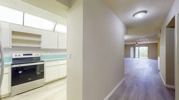 a kitchen with a stove and a microwave