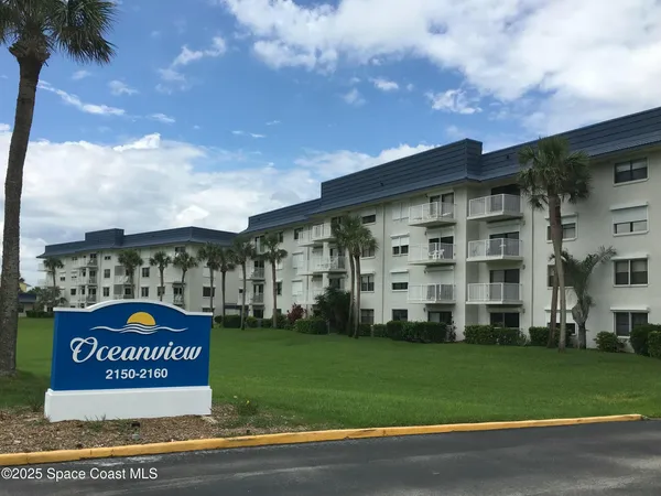 a view of a sign board with a big yard