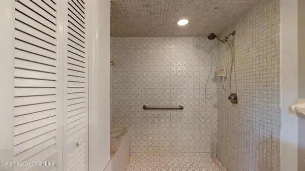 a bathroom with a bathtub and a shower