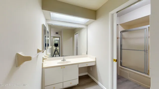a bathroom with a sink and a mirror