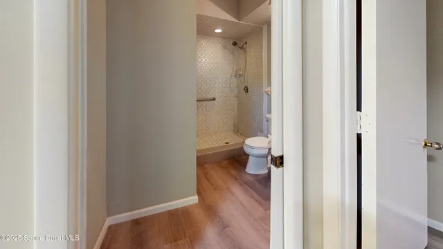 a view of a bathroom from a hallway