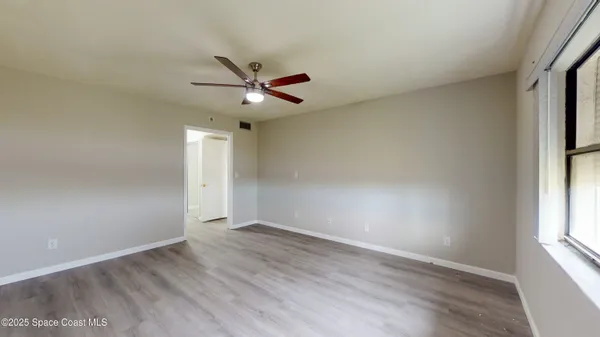 a view of a bathroom from a hallway