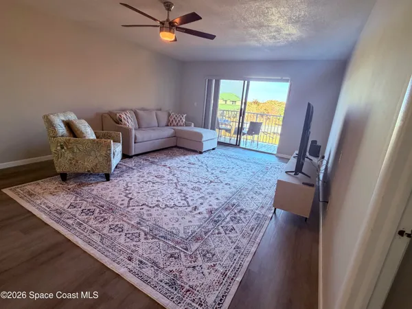 a living room with furniture and a rug