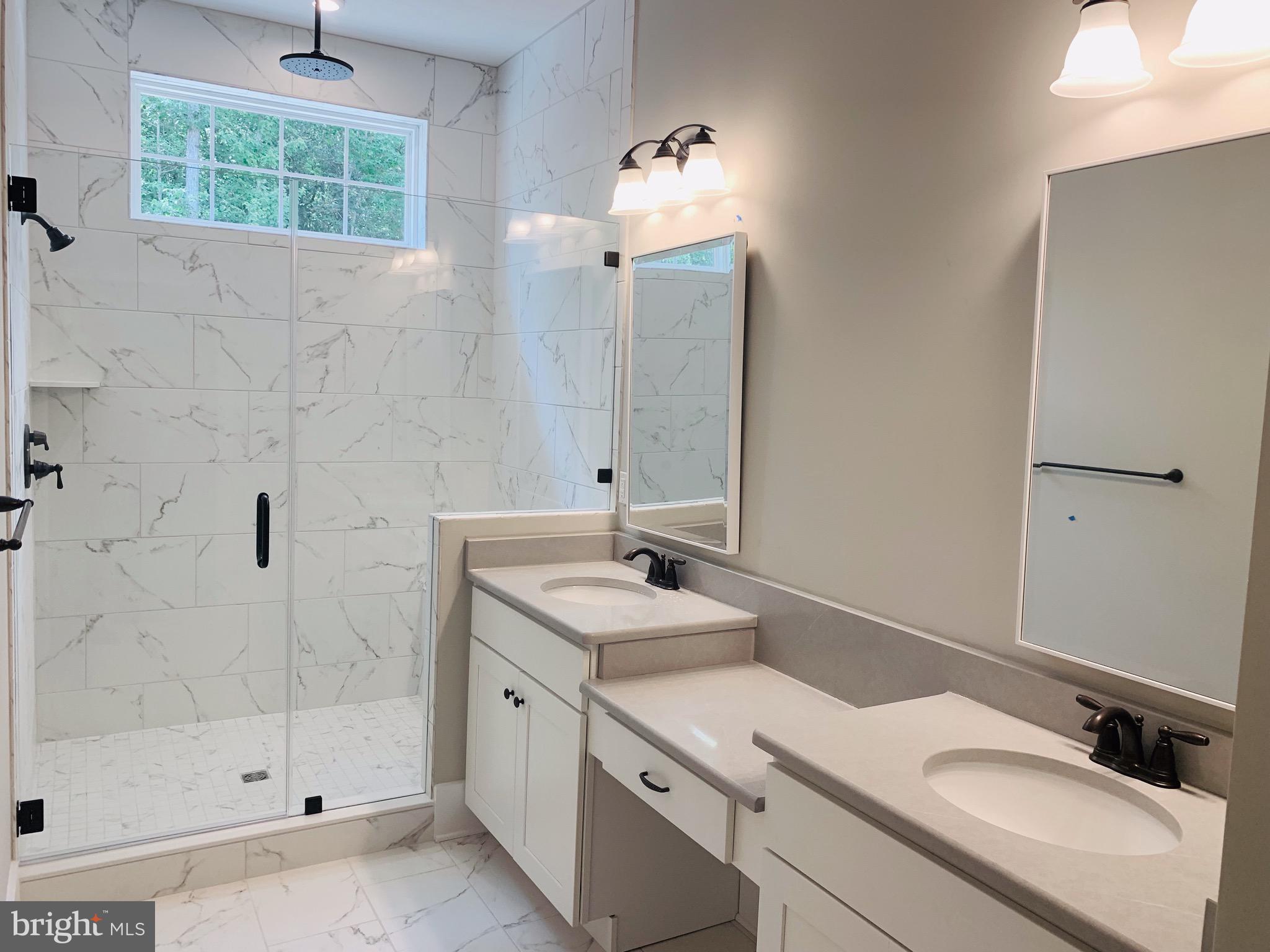 8 Patriots Way Georgetown, DE 19947 - Photo 28 of 38 a bathroom with a sink and a mirror
