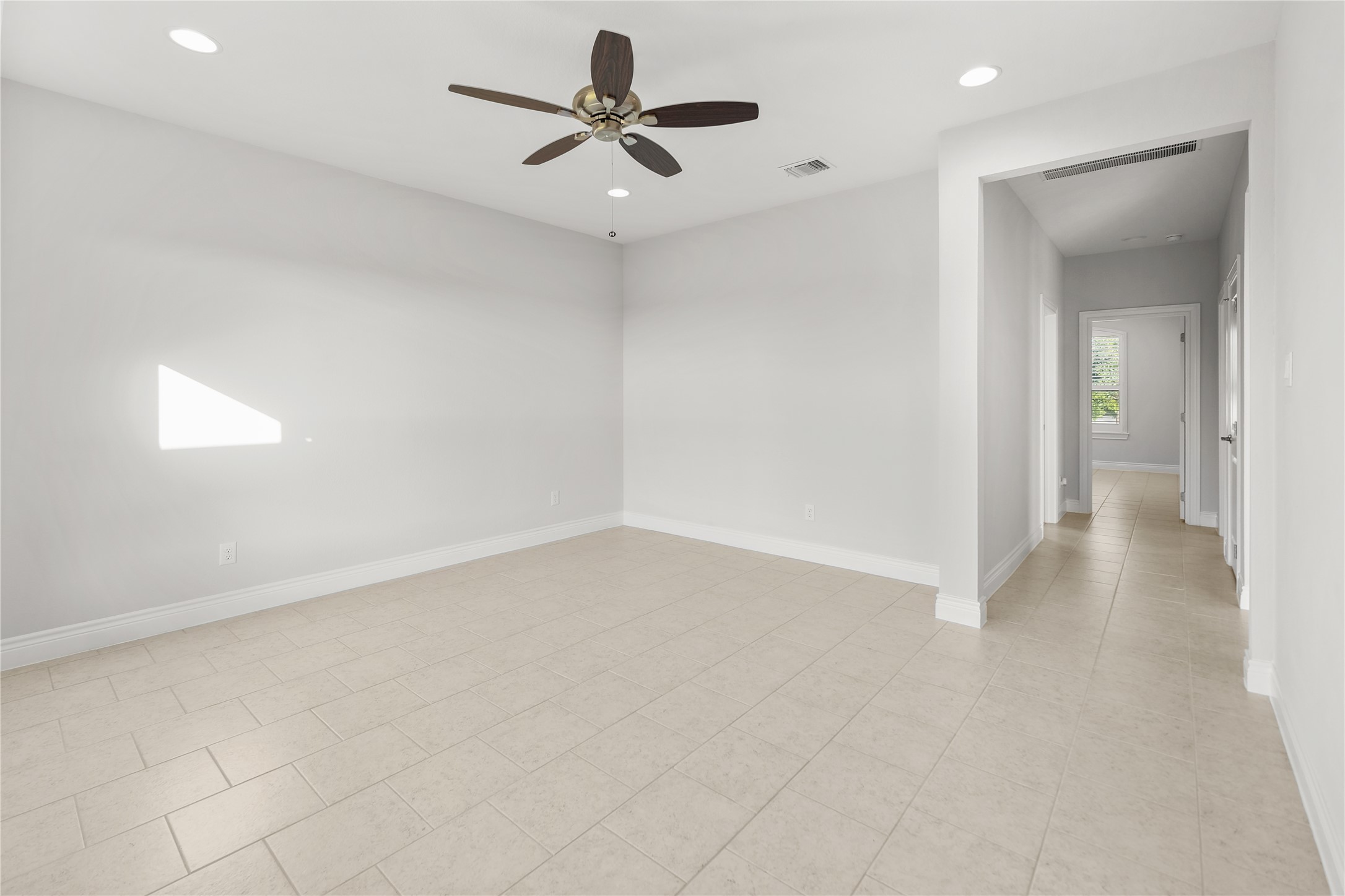 955 Inka Road Salado, TX 76571 - Photo 24 of 39 Clean lines and neutral tile flooring define this versatile interior living space.