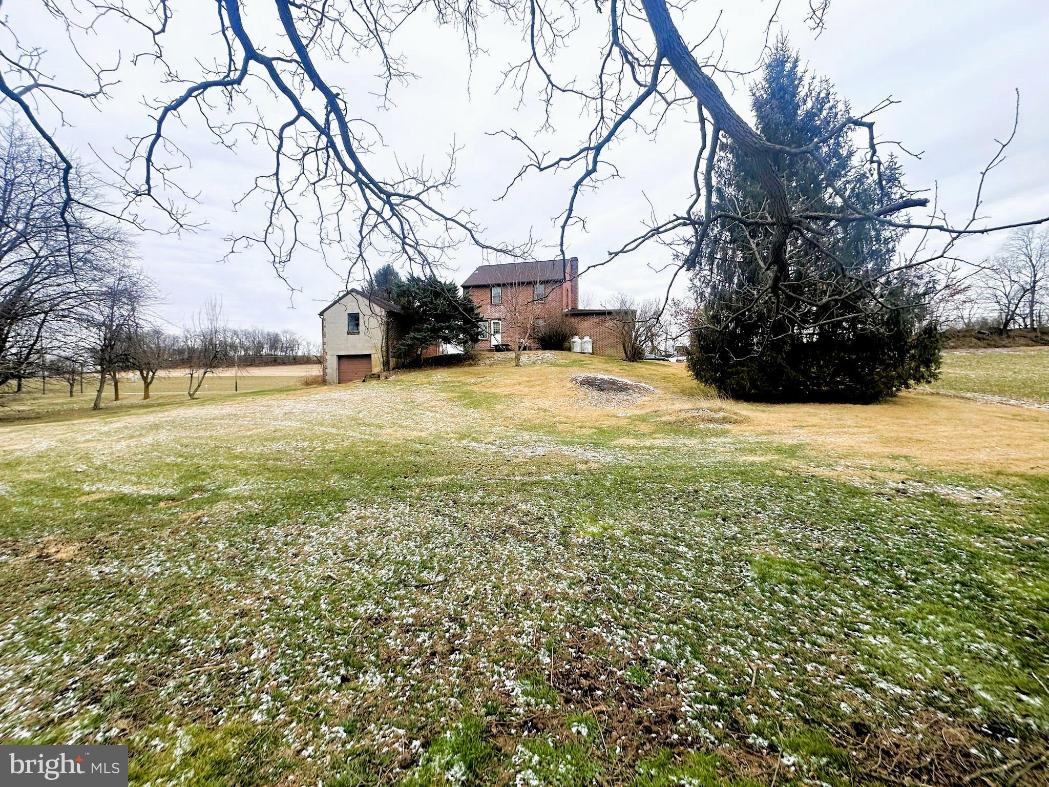 6751 York Road Spring Grove, PA 17362 - Photo 5 of 50 a view of a yard with a house and large trees