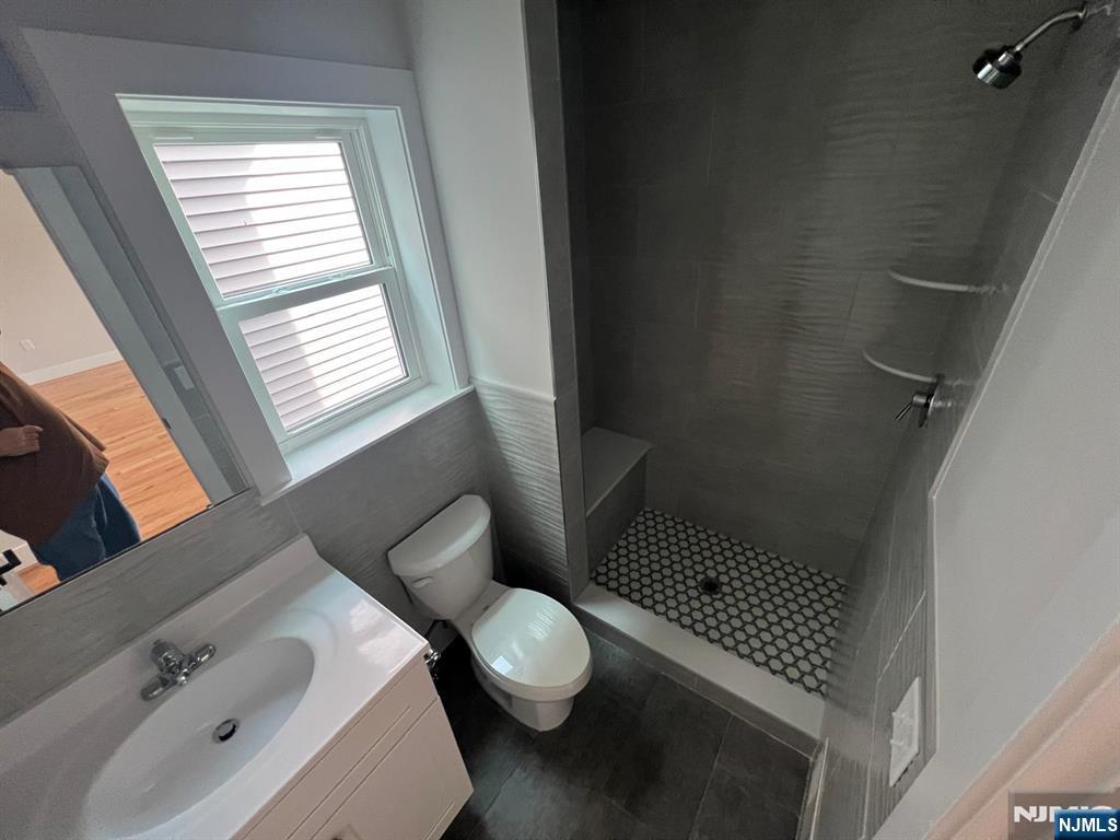 1060 Magnolia Avenue Elizabeth, NJ 07201 - Photo 16 of 22 a bathroom with a sink toilet and shower