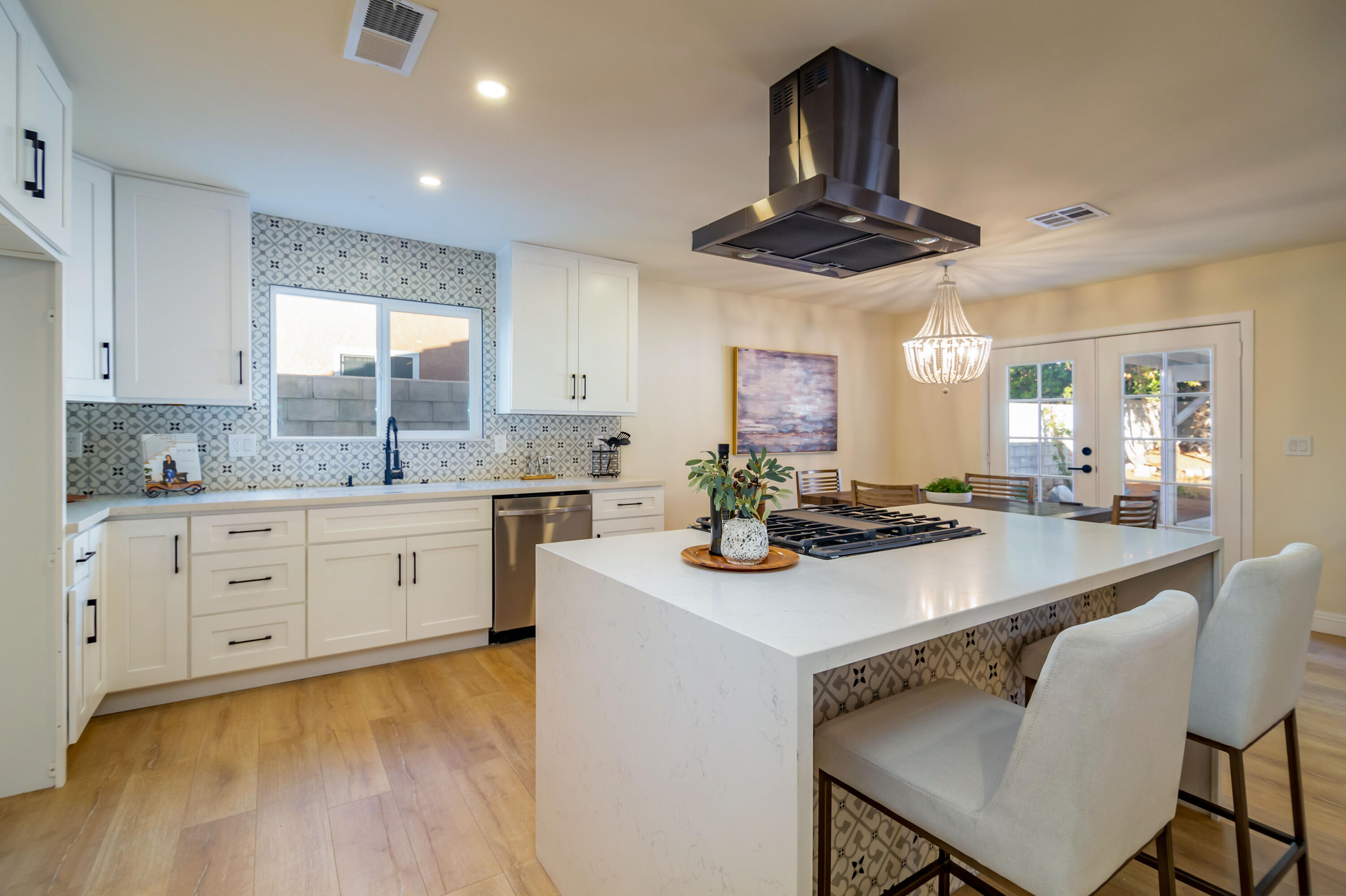 67420 Rango Road Cathedral City, CA 92234 - Photo 14 of 36 a kitchen with stainless steel appliances kitchen island granite countertop a stove a sink and a refrigerator