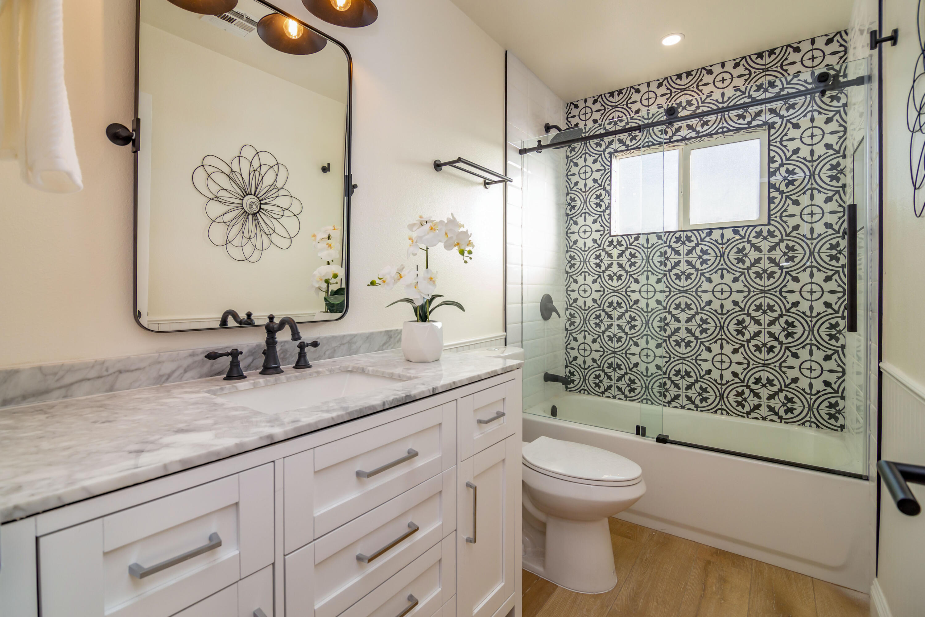 67420 Rango Road Cathedral City, CA 92234 - Photo 20 of 36 a bathroom with a granite countertop sink toilet a mirror and shower