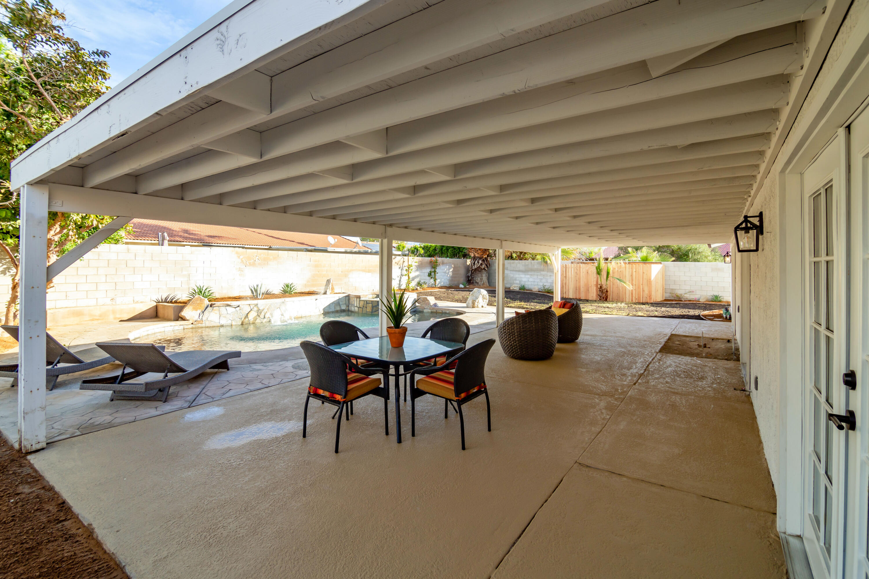 67420 Rango Road Cathedral City, CA 92234 - Photo 26 of 36 a view of a patio with table and chairs