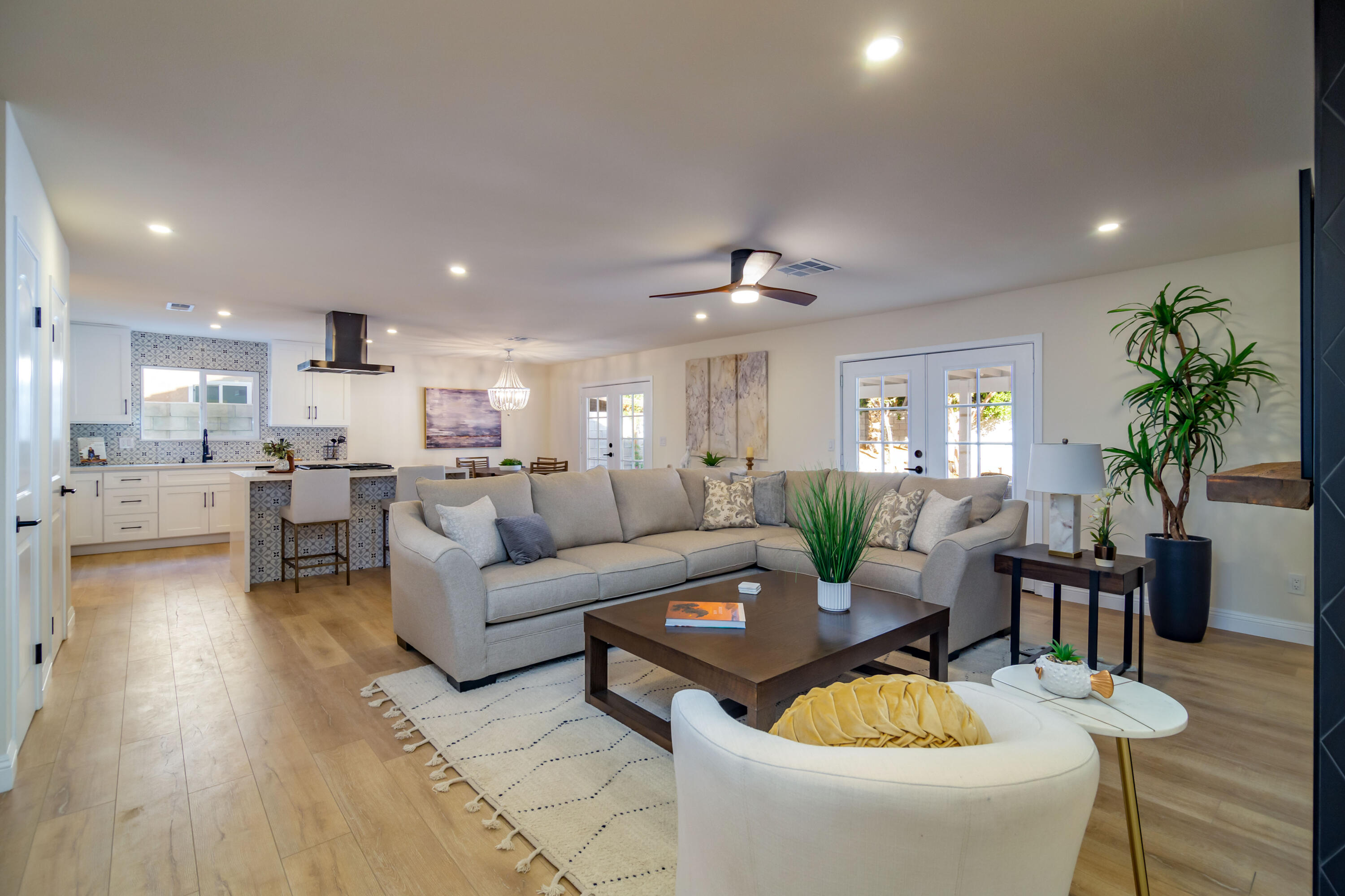 67420 Rango Road Cathedral City, CA 92234 - Photo 6 of 36 a living room with furniture kitchen view and a potted plant