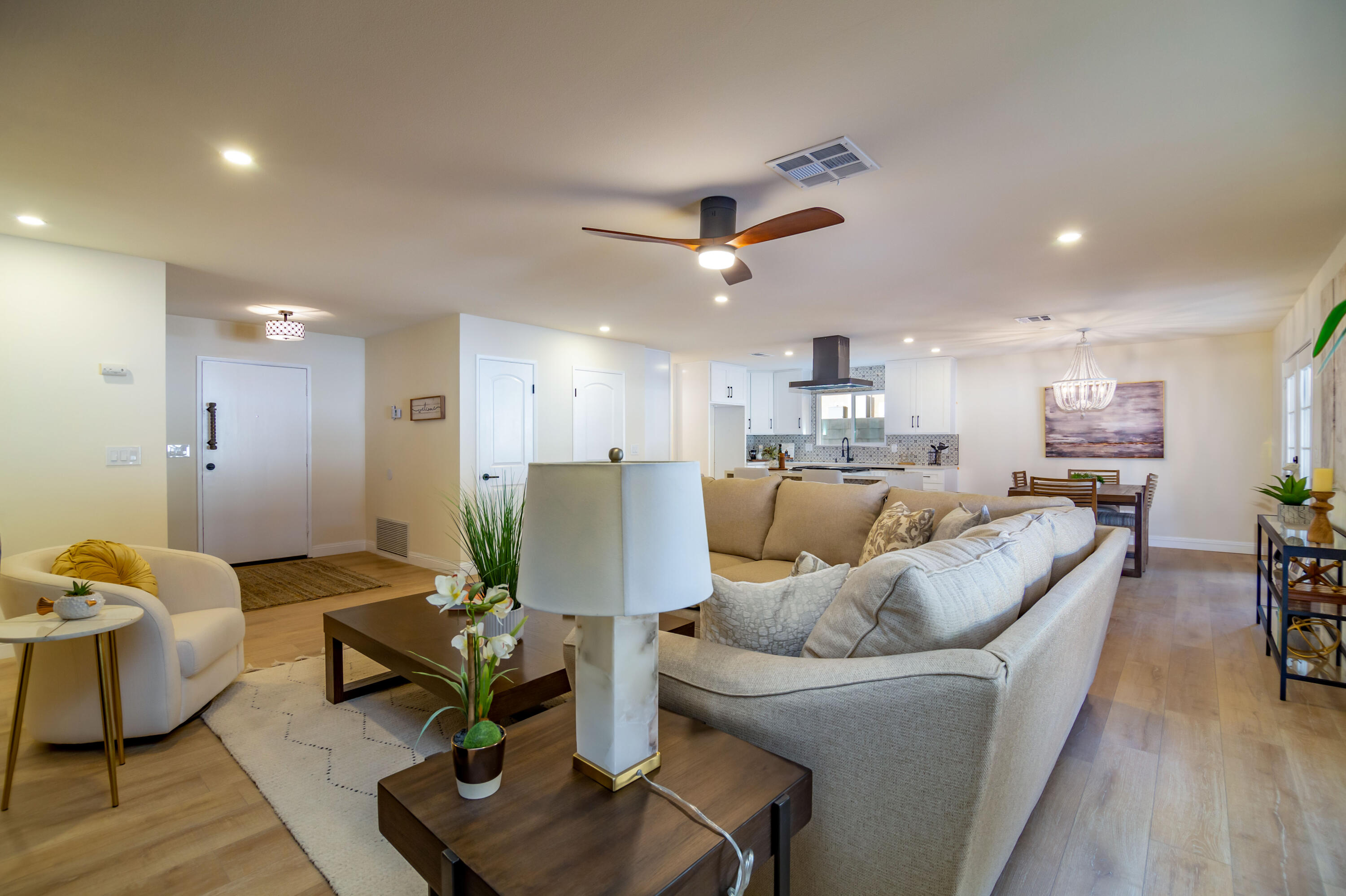 67420 Rango Road Cathedral City, CA 92234 - Photo 10 of 36 a living room with furniture kitchen view and a wooden floor