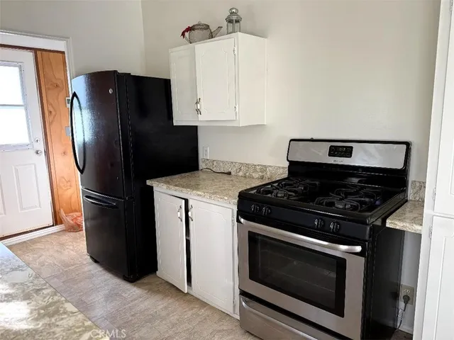 a kitchen with a stove microwave and refrigerator