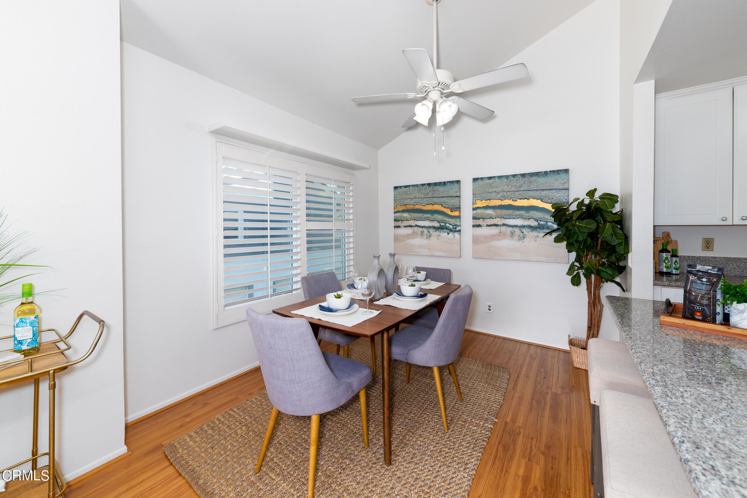 24100 Ave Rancheros, Unit G Diamond Bar, CA 91765 - Photo 7 of 20 a dining room with furniture potted plants and wooden floor