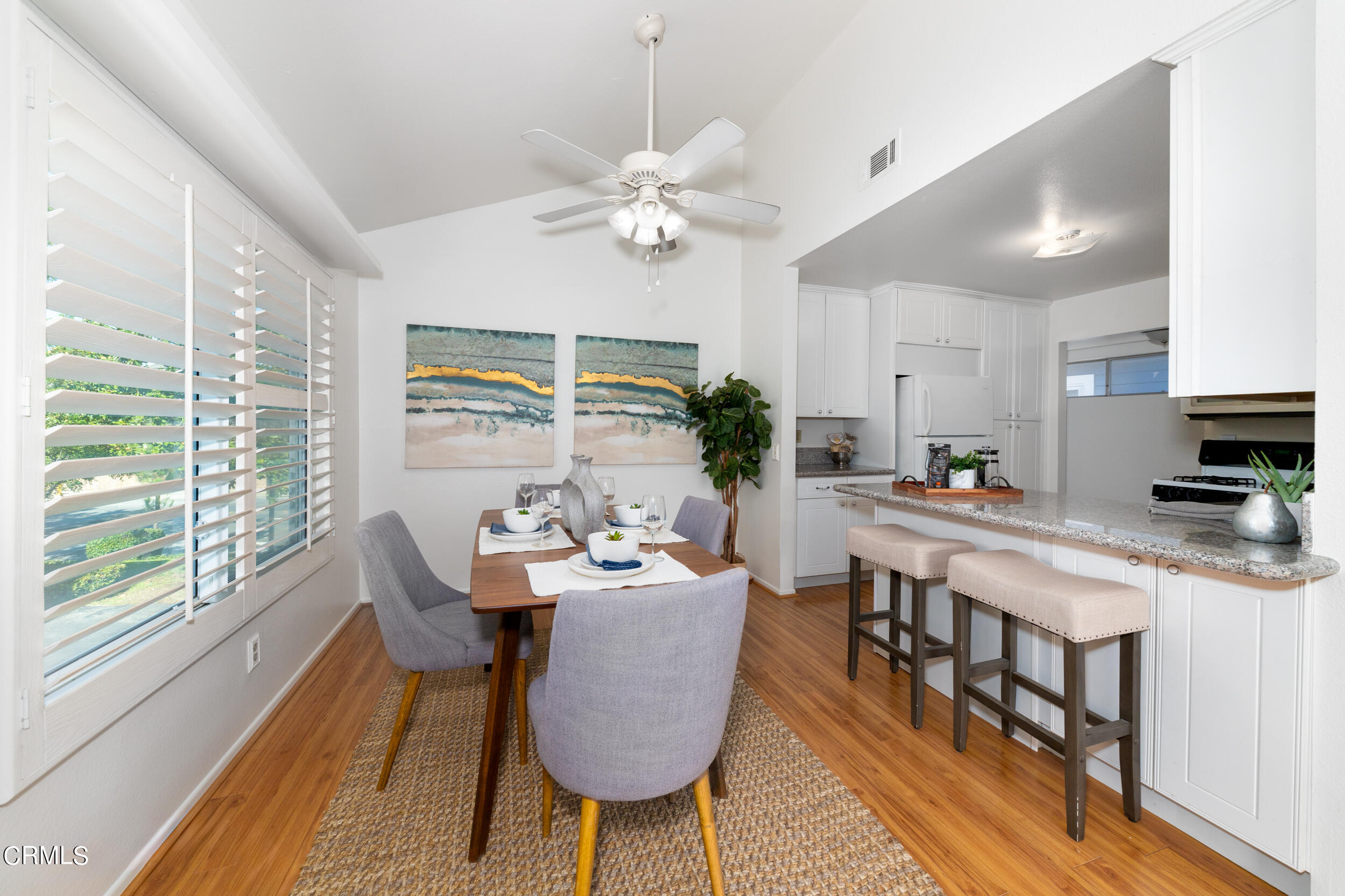 24100 Ave Rancheros, Unit G Diamond Bar, CA 91765 - Photo 9 of 20 a view of a dining room with furniture a chandelier and wooden floor