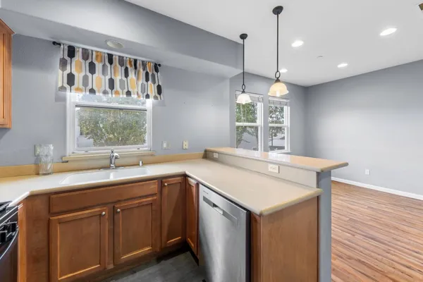 a view of a hallway with windows and entryway