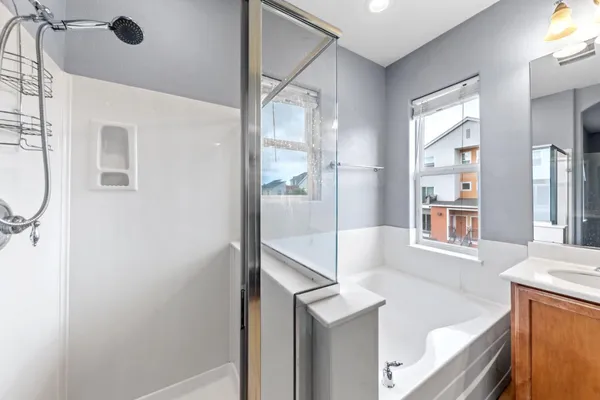 a bathroom with a sink vanity mirror and toilet