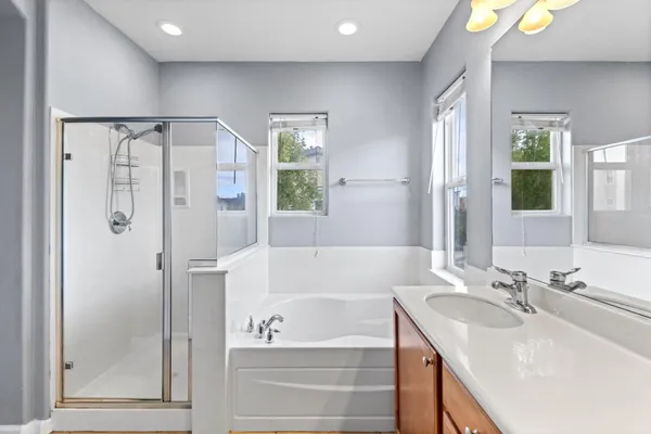 a bedroom with a bed and a lamp on table