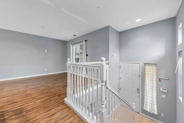 a view of entryway with wooden floor