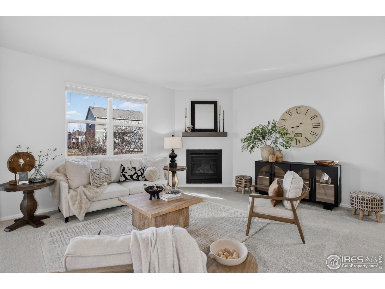 6734 Grainery Road Timnath, CO 80547 - Photo 6 of 44 Living Room boasts a gas fireplace.