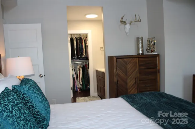 a bedroom with a bed and a walk in closet