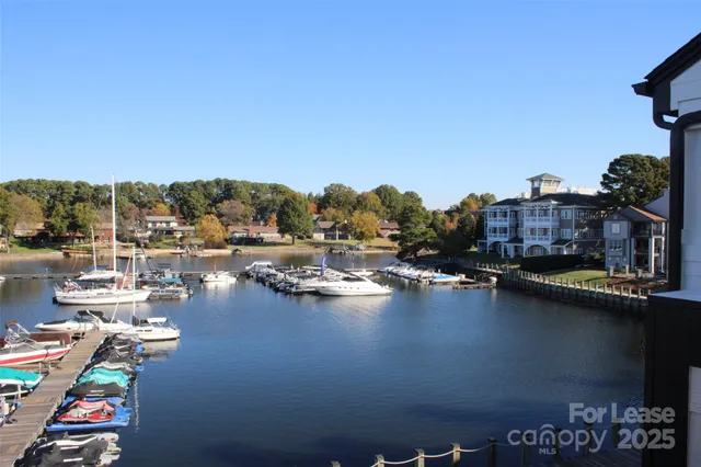 a view of a lake with boats and trees