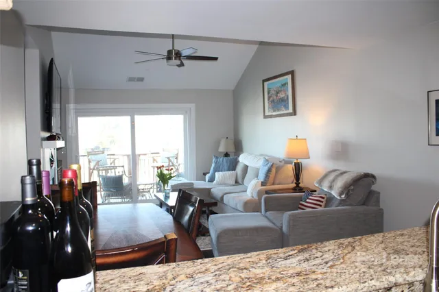 a living room with furniture and a lamp