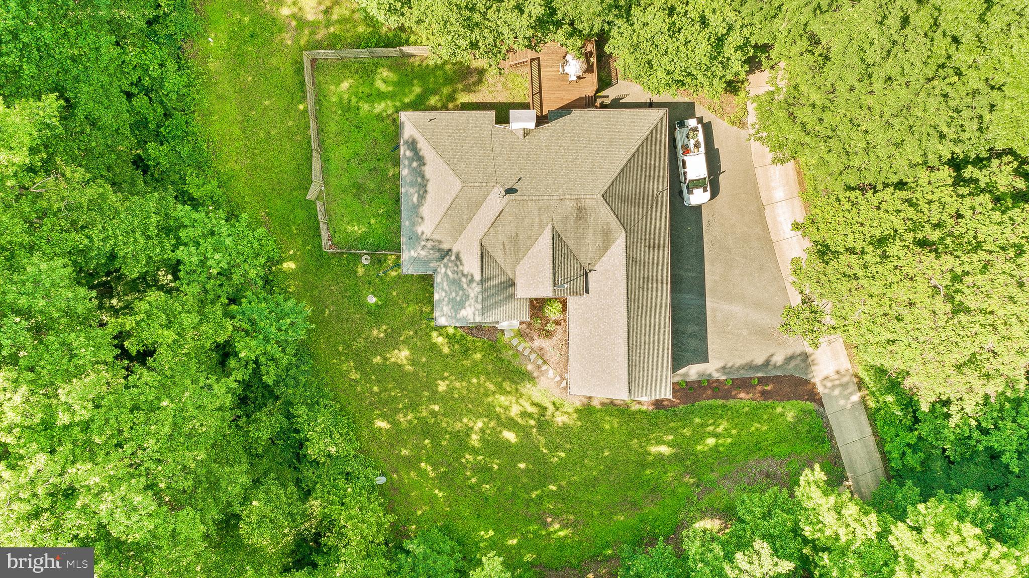 1808 Wilson Road Huntingtown, MD 20639 - Photo 51 of 53 an aerial view of a house with a yard and trees