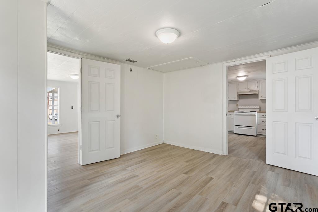 210 Cooper Street Lindale, TX 75771 - Photo 14 of 23 wooden floor in an empty room