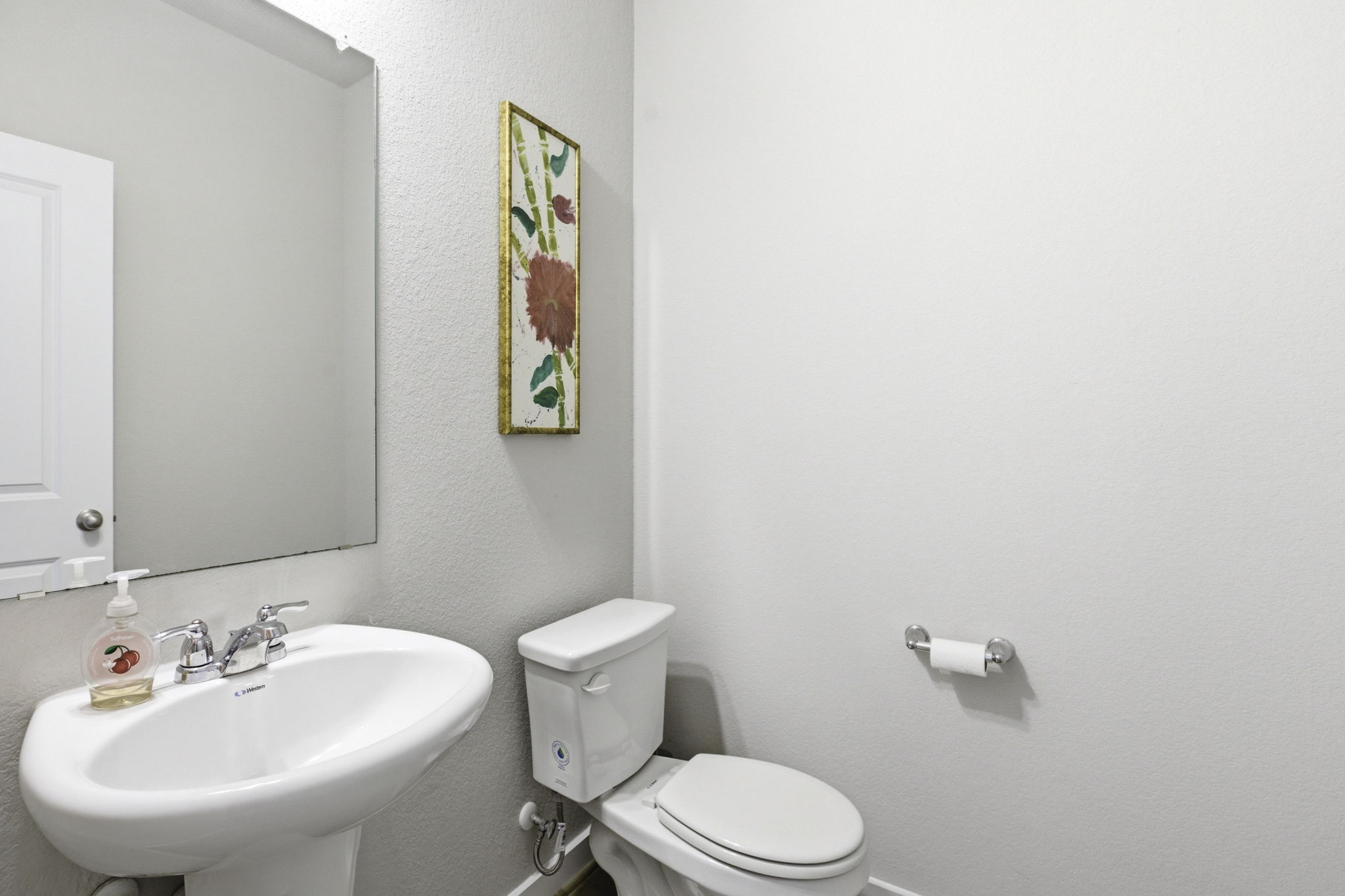 17205 Leafroller Drive, Unit B Pflugerville, TX 78660 - Photo 15 of 32 a bathroom with a sink mirror and toilet
