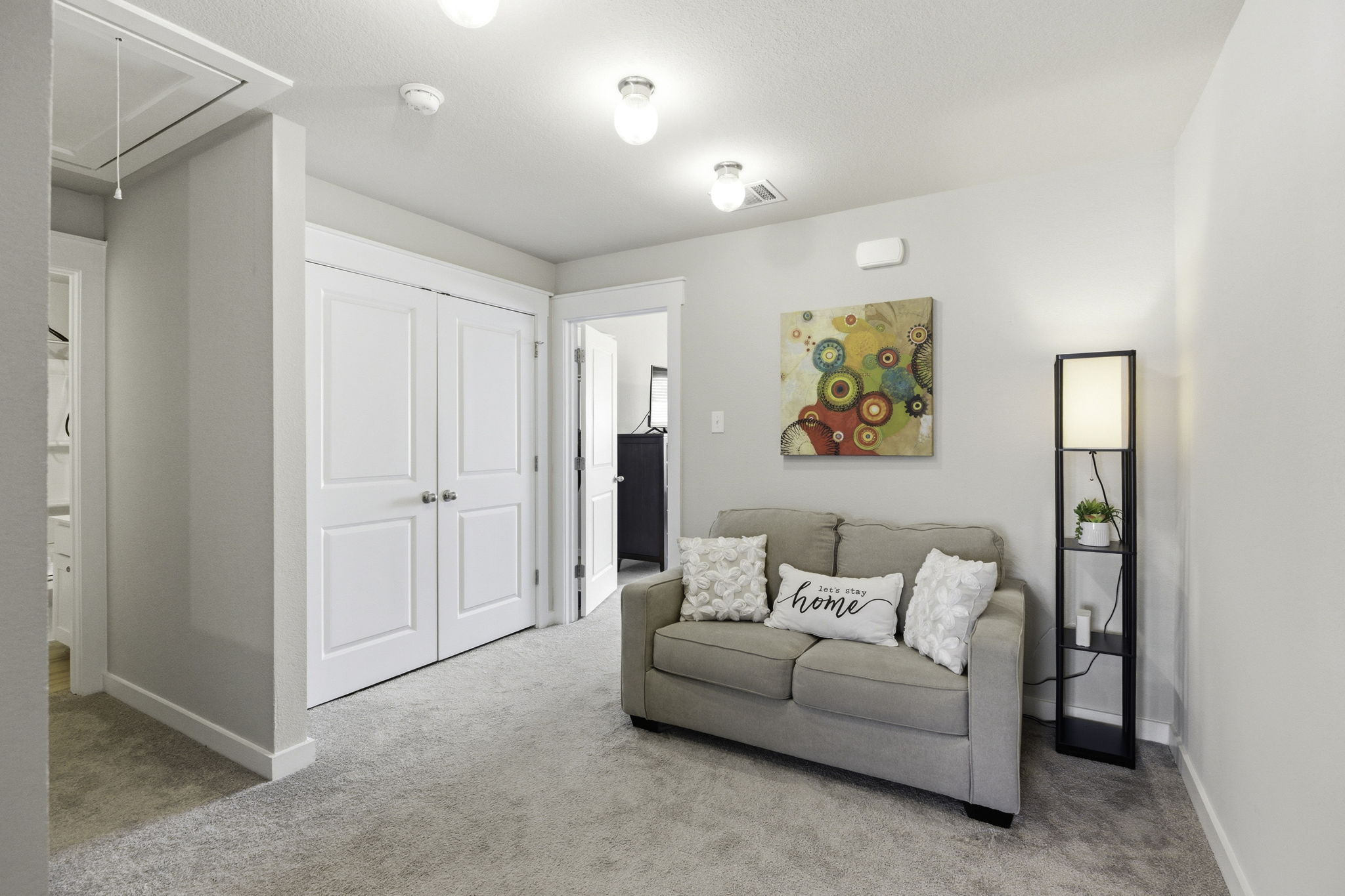 17205 Leafroller Drive, Unit B Pflugerville, TX 78660 - Photo 17 of 32 a living room with furniture and a walk in closet