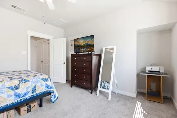 a bedroom with a bed and furniture