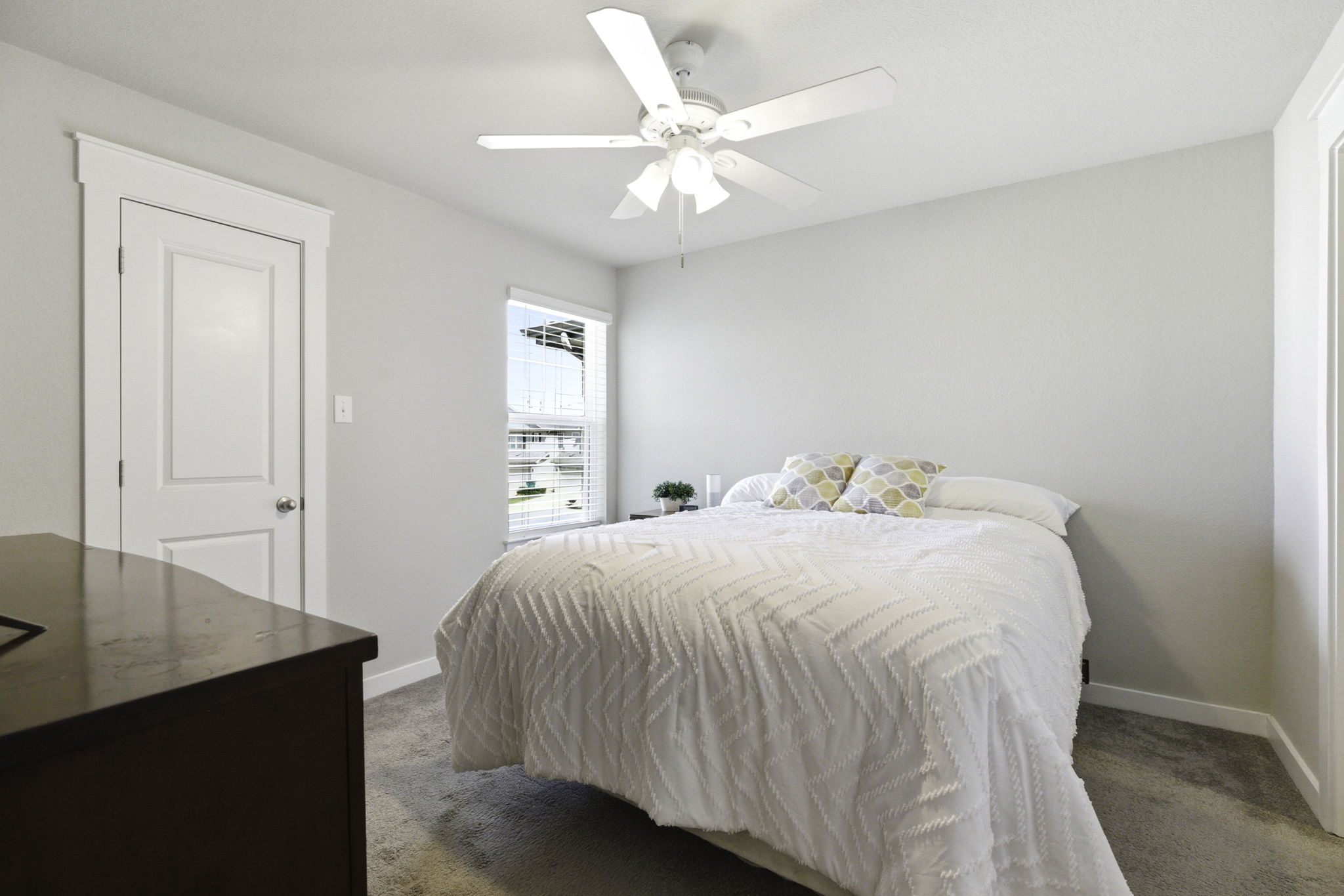 17205 Leafroller Drive, Unit B Pflugerville, TX 78660 - Photo 24 of 32 a bedroom with a bed and a table