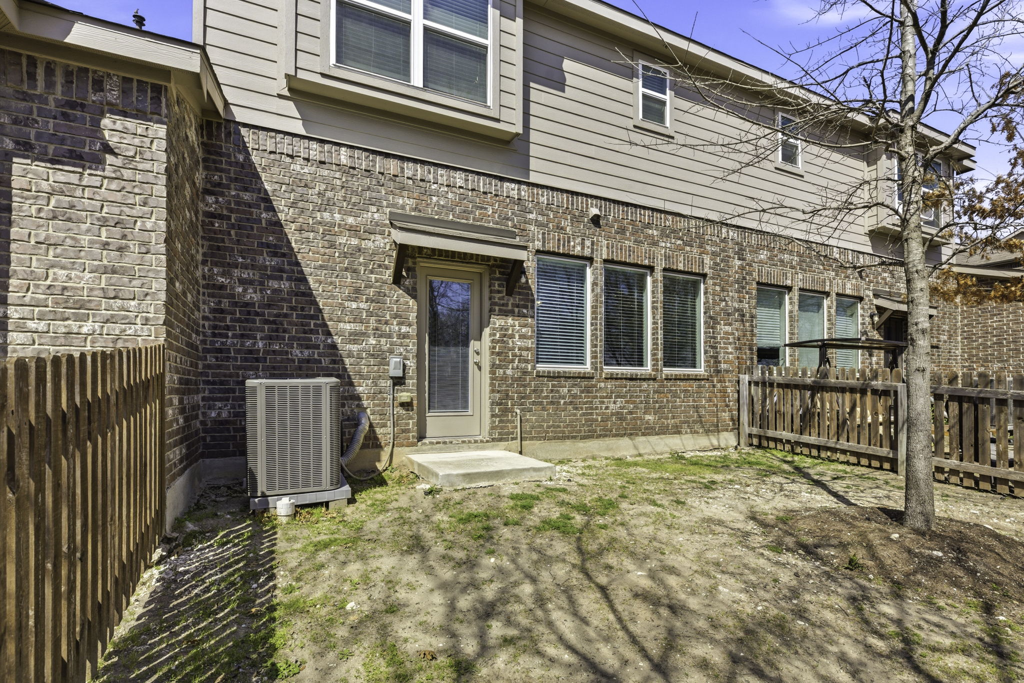 17205 Leafroller Drive, Unit B Pflugerville, TX 78660 - Photo 28 of 32 a front view of a house with a large tree