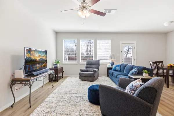 a living room with furniture and a flat screen tv