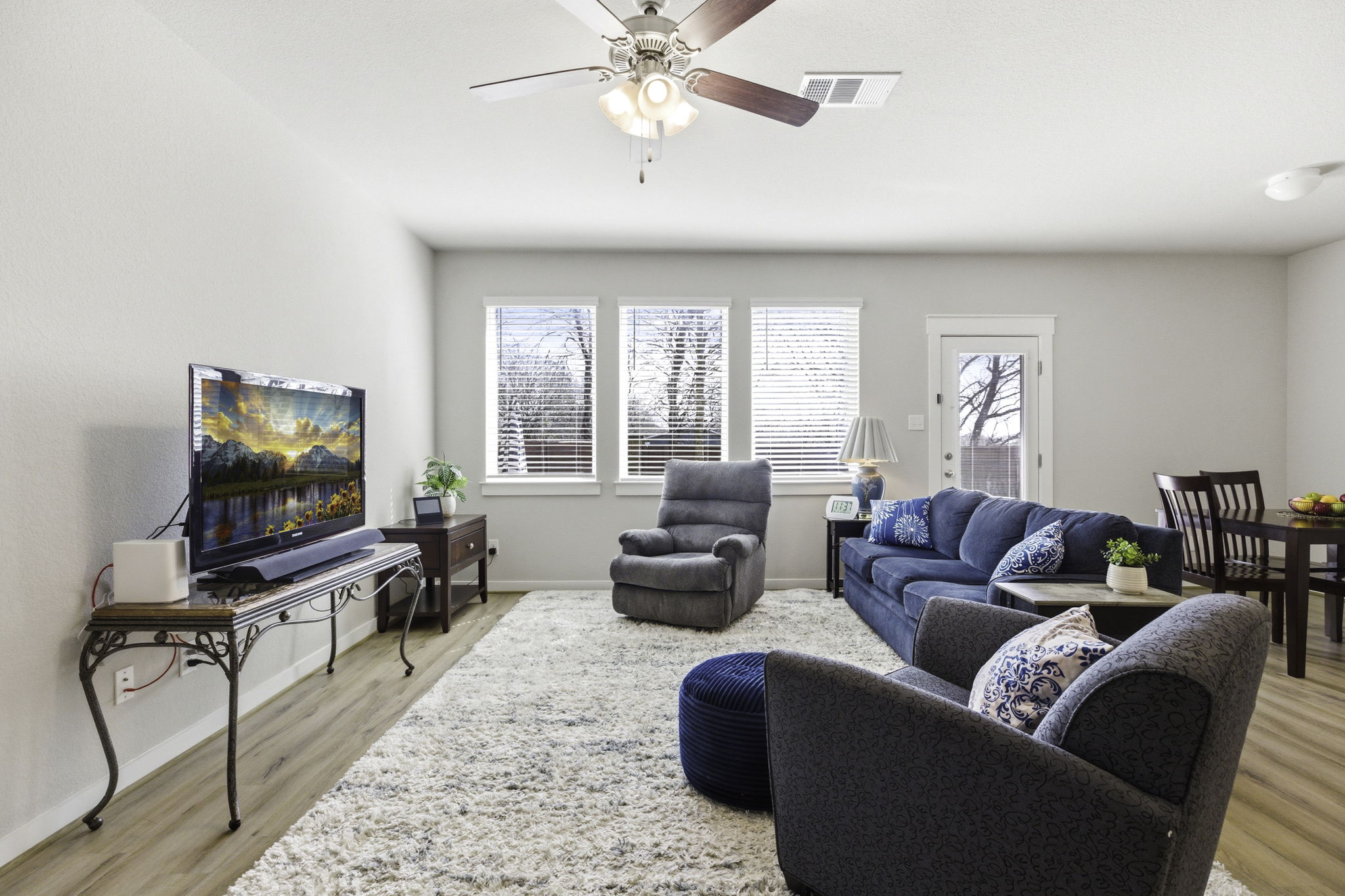 17205 Leafroller Drive, Unit B Pflugerville, TX 78660 - Photo 7 of 32 a living room with furniture and a flat screen tv