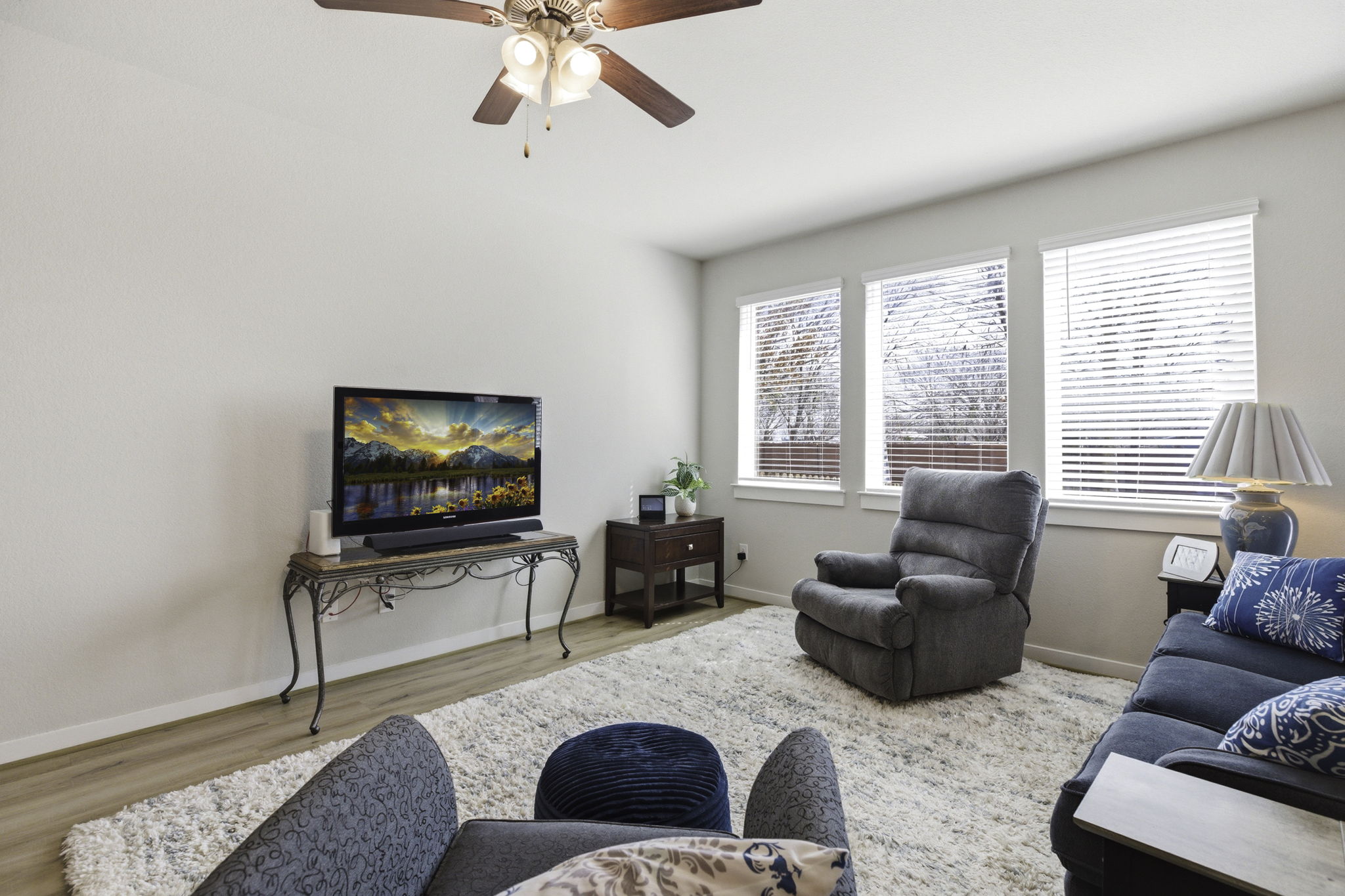 17205 Leafroller Drive, Unit B Pflugerville, TX 78660 - Photo 8 of 32 a living room with furniture and a flat screen tv