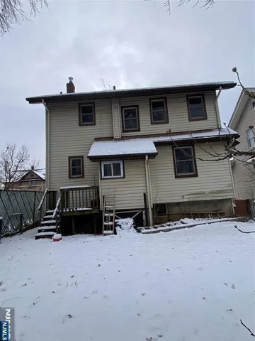 a front view of a house with parking space