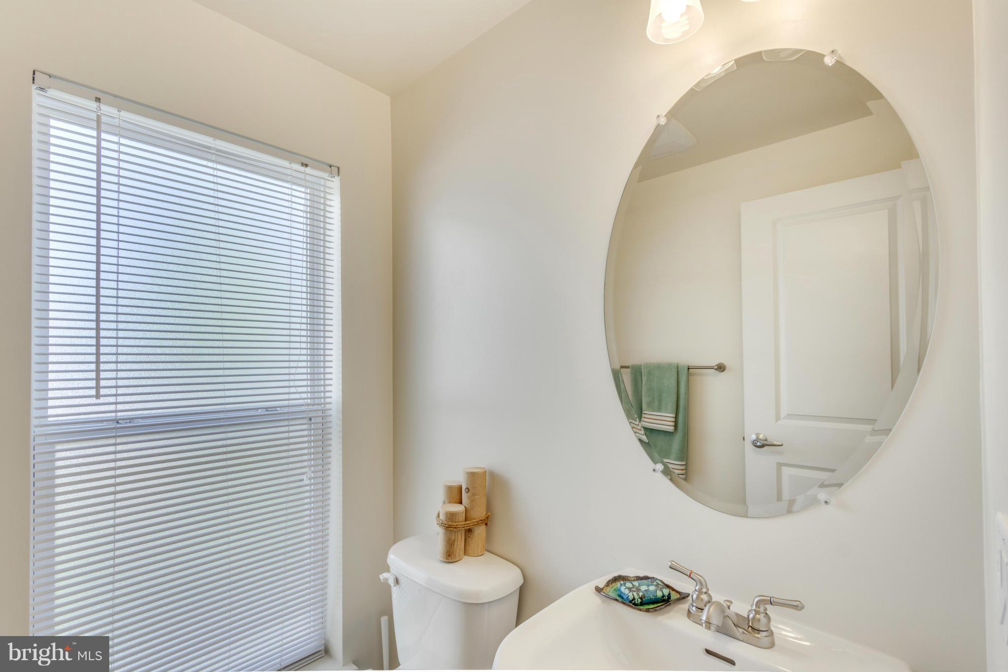 2524 Sheridan Road Southeast Washington, DC 20020 - Photo 11 of 20 a bathroom with a toilet sink and mirror