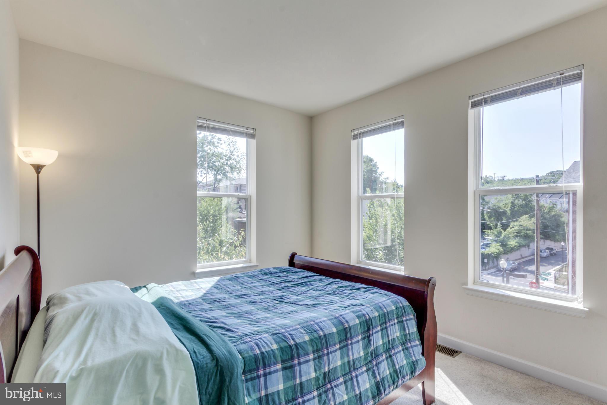 2524 Sheridan Road Southeast Washington, DC 20020 - Photo 13 of 20 a bedroom with a bed and a window