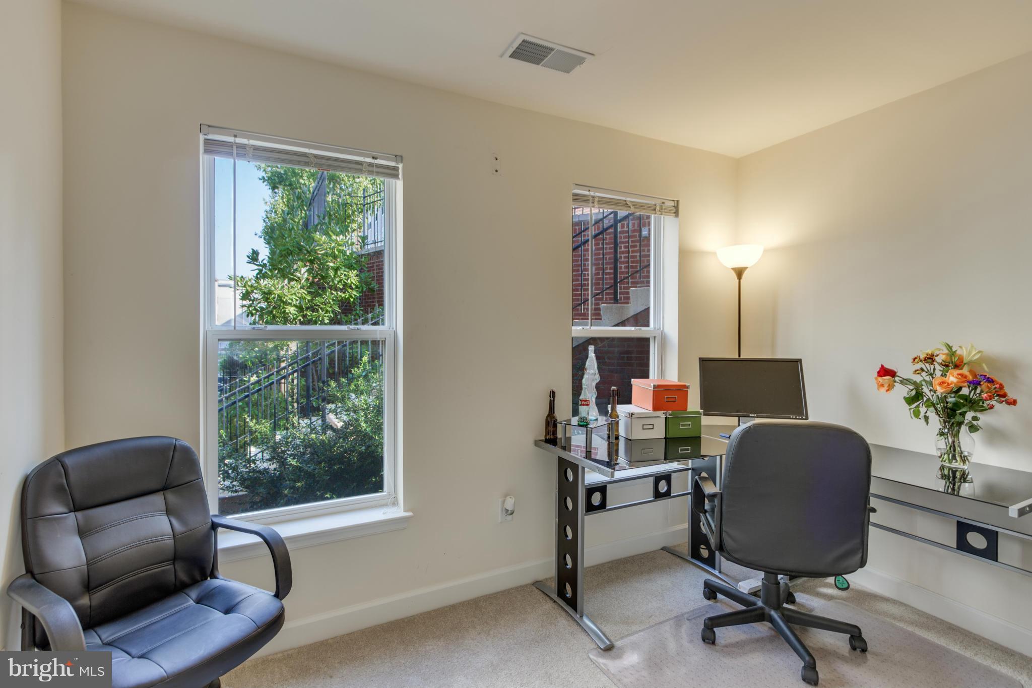 2524 Sheridan Road Southeast Washington, DC 20020 - Photo 4 of 20 a view of a workspace with furniture and a window