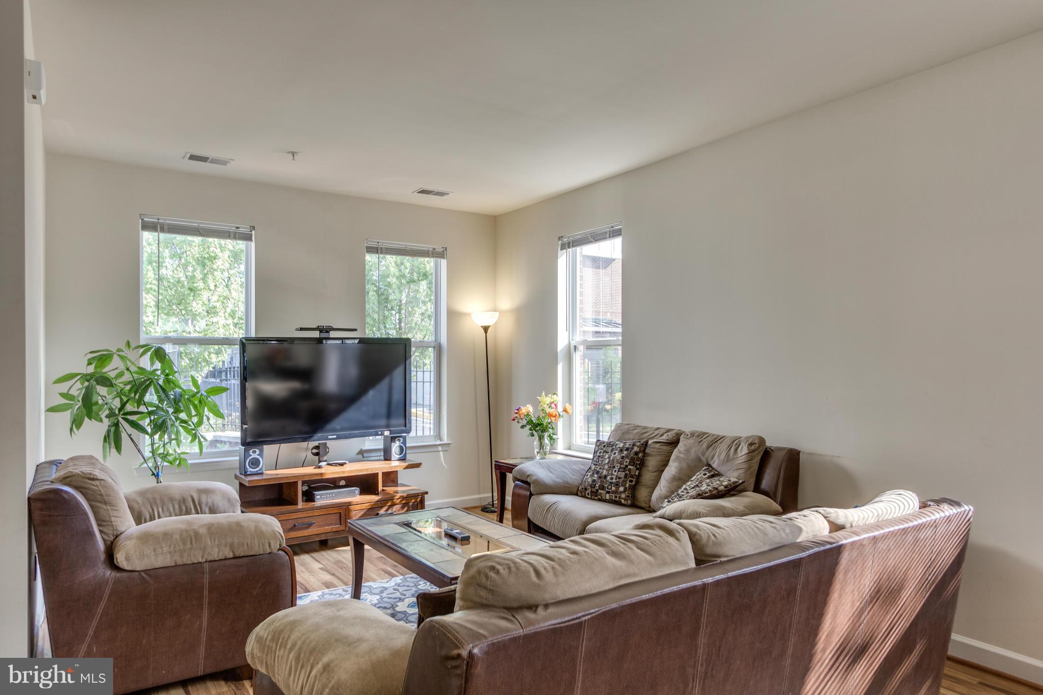 2524 Sheridan Road Southeast Washington, DC 20020 - Photo 5 of 20 a living room with furniture and a flat screen tv